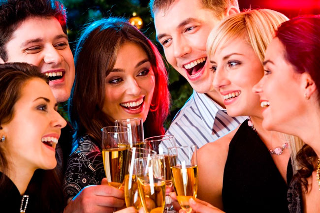 People gather at a holiday party, part of being your own matchmaker during the holidays
