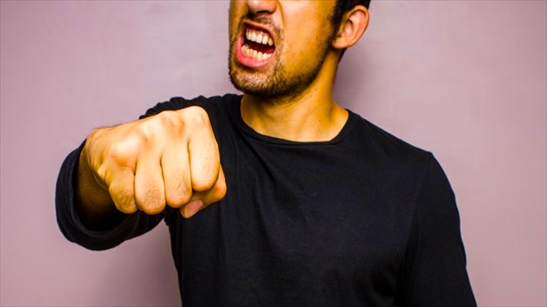 Angry-Man-Throwing-A-Punch-Shutterstock