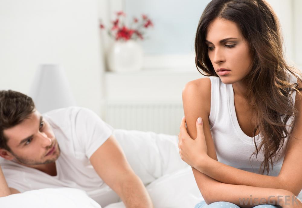 woman-and-man-looking-upset-in-bed