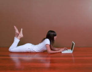 Woman sits on computer online dating, creating mental masturbation