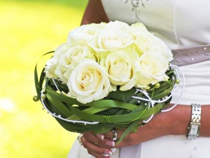 Woman holds perfect flowers for her wedding day