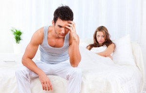 Man is frustrated on bed that he didn't get laid