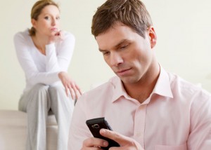 Woman snoops on her man looking at his phone calls and text messages