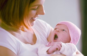 Woman holds her newborn baby